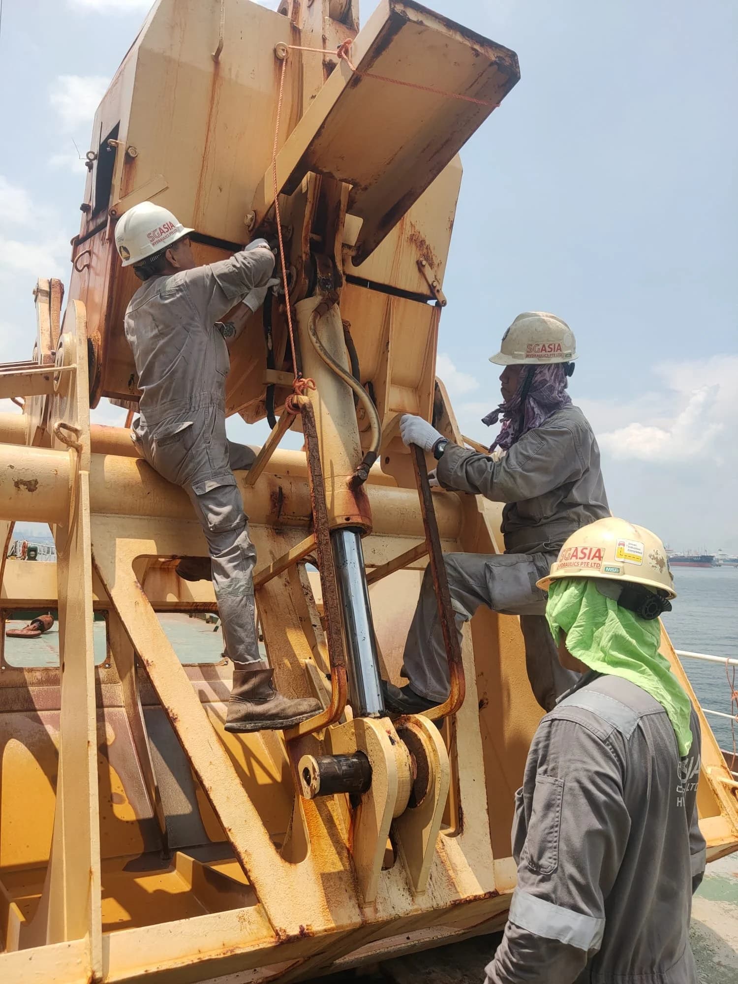 SG Asia Hydraulics crew working on deck equipment offshore